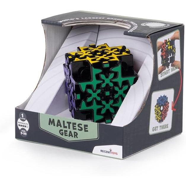 Boxed puzzle cube labeled "Meffert's Maltese Gear," featuring colorful interlocking pieces visible through the packaging. This brainteaser puzzle is suitable for ages 9 to 99 and promises hours of fun as you twist and turn the gears.