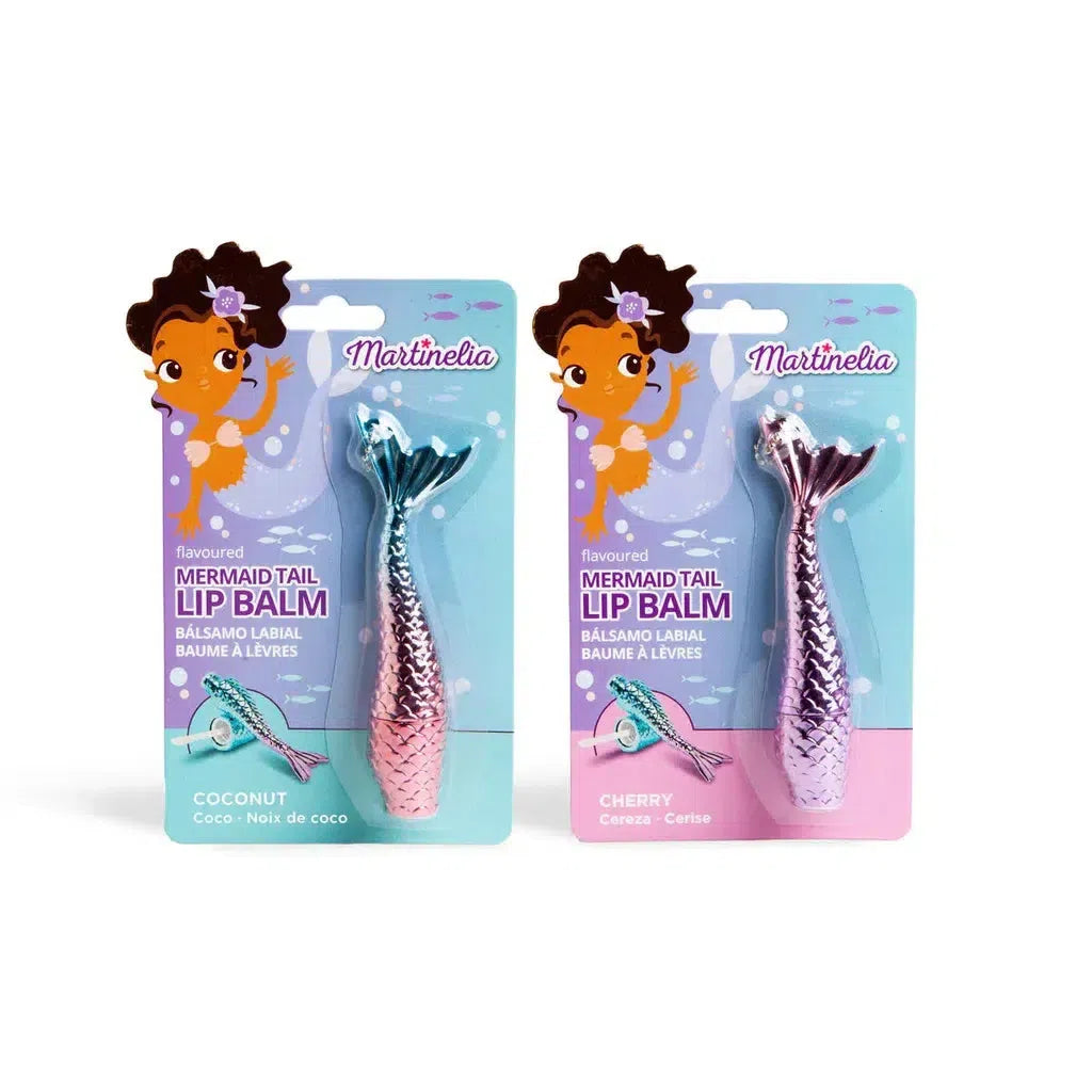 Two enchanting lip balm packages with whimsical mermaid's tail designs double as charming key rings. One, in oceanic blue, is labeled "Coconut," while the other, in a rosy pink hue, bears the label "Cherry." Both spotlight a delightful cartoon mermaid illustration.