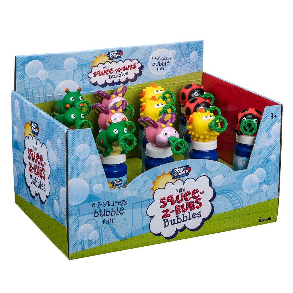 Display of colorful, animal-themed bubble bottles, labeled "Mini Squee-Z Bub Bubbles," filled with vibrant bubble solution. These delightful bubble toys are perfect for ages 3 and up.