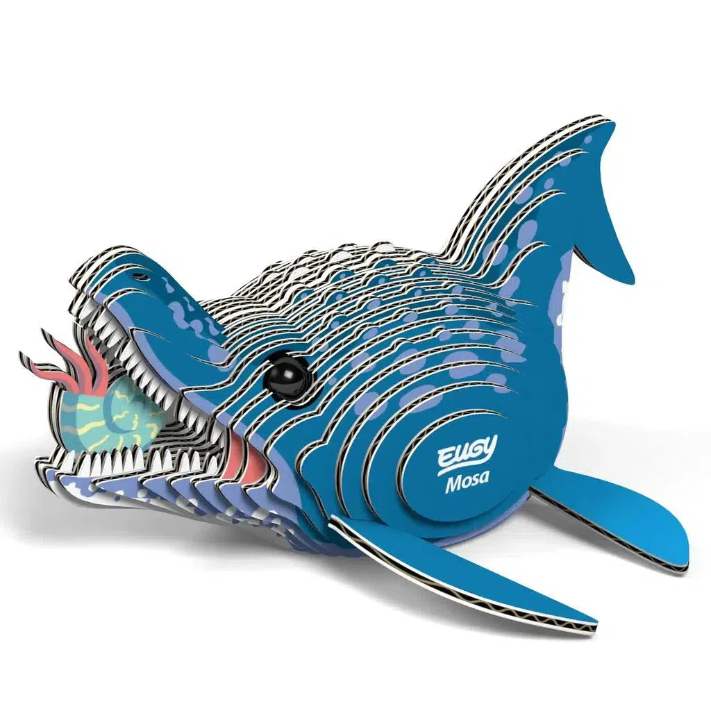 This eco-friendly 3D puzzle model showcases a blue and white prehistoric aquatic creature with an open mouth and visible layers, proudly labeled EUGY Mosa.