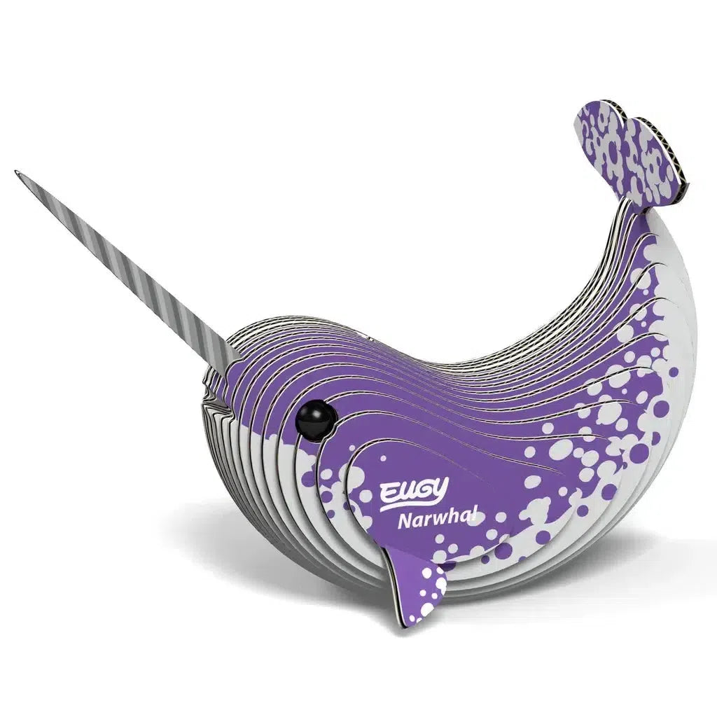 Dive into STEM concepts with this eco-friendly 3D puzzle model of a narwhal, crafted from layered cardboard pieces. Featuring a striking striped horn and a purple speckled design, it's both an educational journey and a delightful display piece.