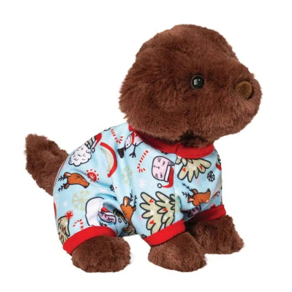 A Douglas Mini chocolate lab in cozy blue pajamas with red trim and winter-themed designs sits facing right