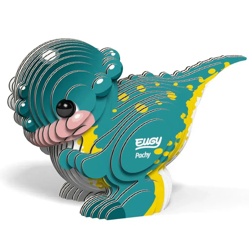 This eco-friendly 3D puzzle features Pachy, a cartoonish teal dinosaur with yellow spots, crafted from layered pieces that introduce STEM concepts in a playful way.