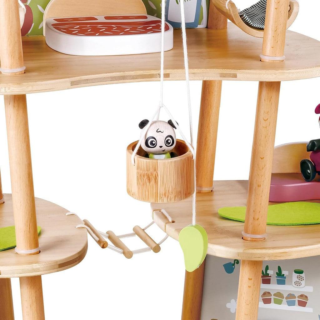 Explore the enchanting Hape Pandas’ Bamboo House, a wooden toy set featuring a staircase, small swing with a panda figurine, and vibrant accessories. Perfect for imaginative adventures with Green Planet Explorers, this educational toy doll house nurtures creativity and curiosity.