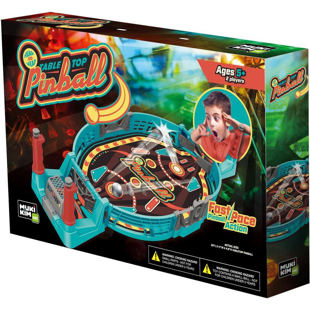 The vibrant box packaging of the MUKIKIM Head-to-Head Table Top Pinball showcases a lively mini pinball setup for ages 5+, capturing the thrill of a child’s excitement in this engaging 2-player family board game.