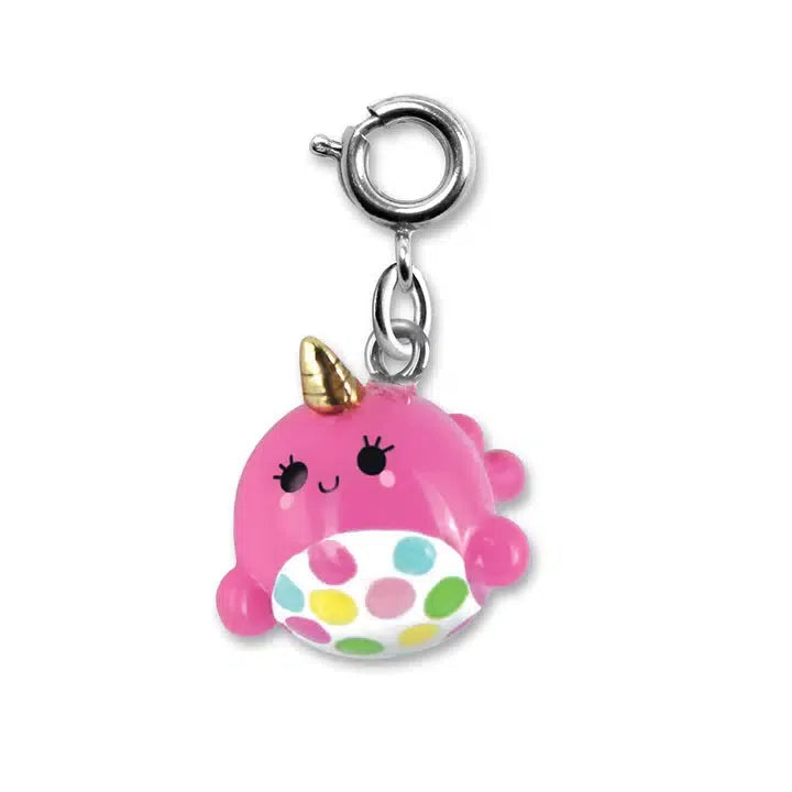 A small, pink narwhal charm with a gold horn and polka-dotted belly, reminiscent of magical ocean creatures like unicorns. It features a metal loop perfect for attaching to any piece of jewelry.