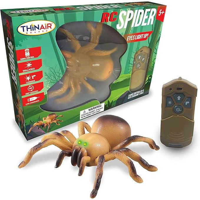 Image of a Remote Control Spider toy with light-up eyes by ThinAir. The package includes the spider, a remote control, and is labeled for ages 5+. Enjoy thrilling radio control crawling action with this spooky toy!