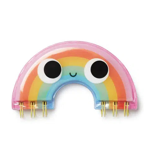 Small notebook shaped like a rainbow with a cartoon face