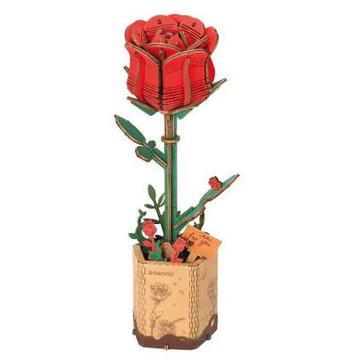 Wooden red rose on a stem standing in a wooden base