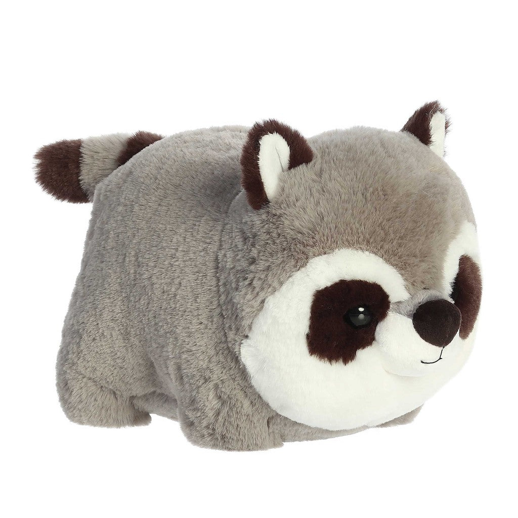 Meet Rory Raccoon, a delightful Spudsters plush toy shaped like a chubby raccoon with grey fur, dark eye patches, and a charming striped tail.