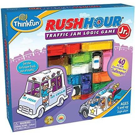 The box cover of "Rush Hour Junior" by ThinkFun showcases this vibrant Traffic Jam Logic Game designed for ages 5 and up, featuring colorful toy vehicles and an enticing ice cream truck. Perfect as a STEM Toy, it engages young minds in strategic play.