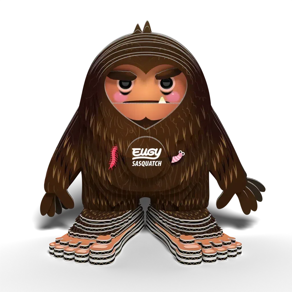 Illustration of a cartoon-like Sasquatch figure with large feet, fur, and an expressionless face. This eco-friendly character is labeled "Eugy Sasquatch" and features small decorative elements, making it the perfect collectable toy for enthusiasts.