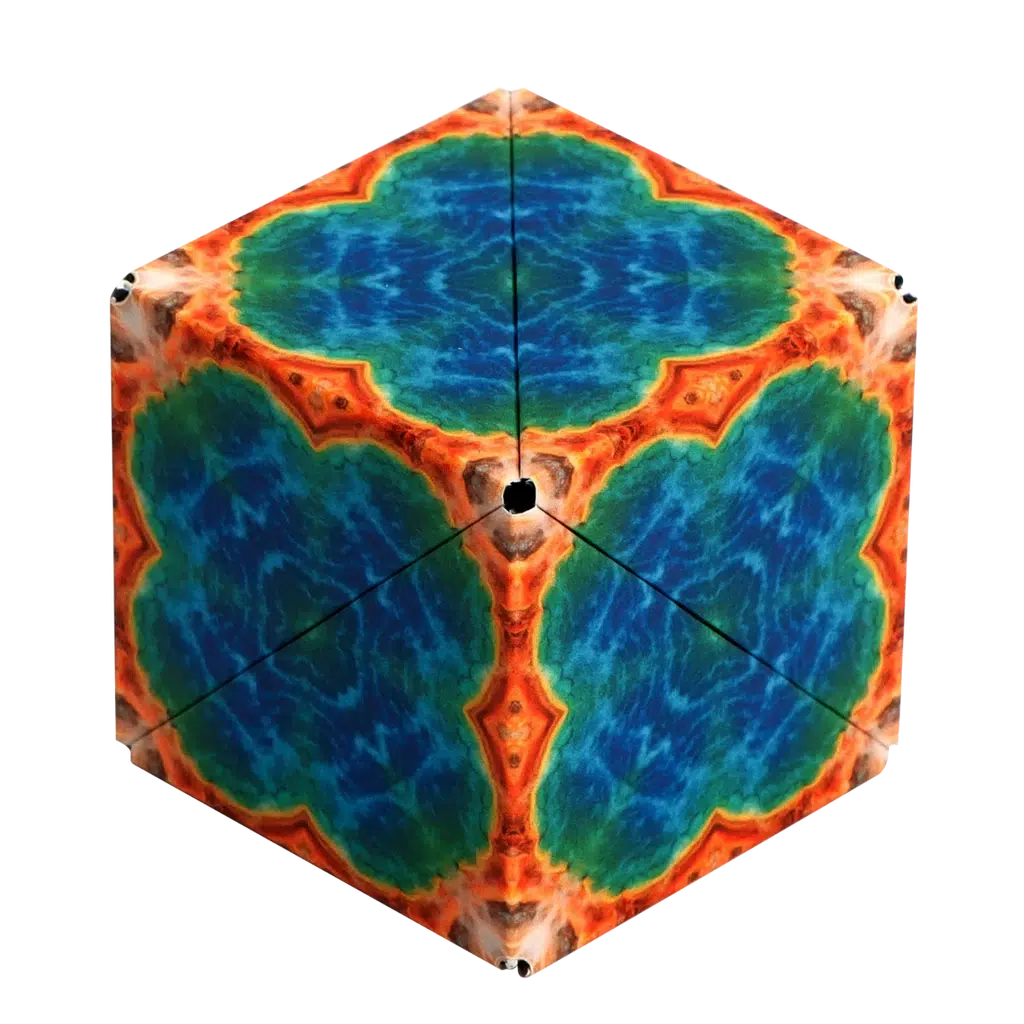 A Shashibo featuring hexagonal patterns in vibrant blue, green, and orange colors boasts symmetrical designs on each face. This magnetic puzzle cube invites geometric transformations, revealing its mesmerizing shapes and possibilities.