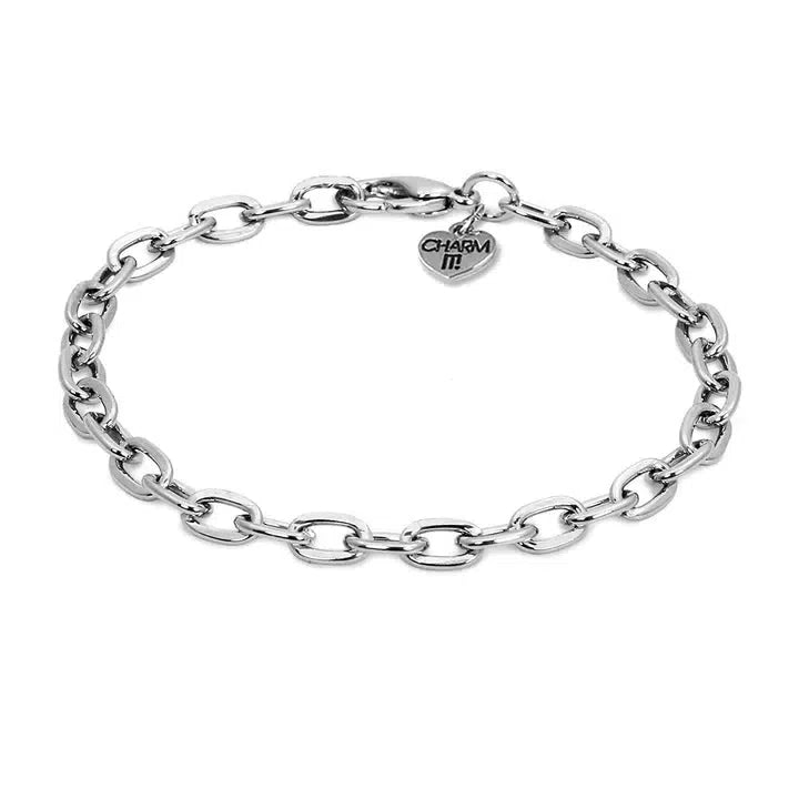 Silver chain bracelet featuring a small heart-shaped charm engraved with "Charm It!". Easily customize your look by adding more charms to create a unique bracelet that suits your style.