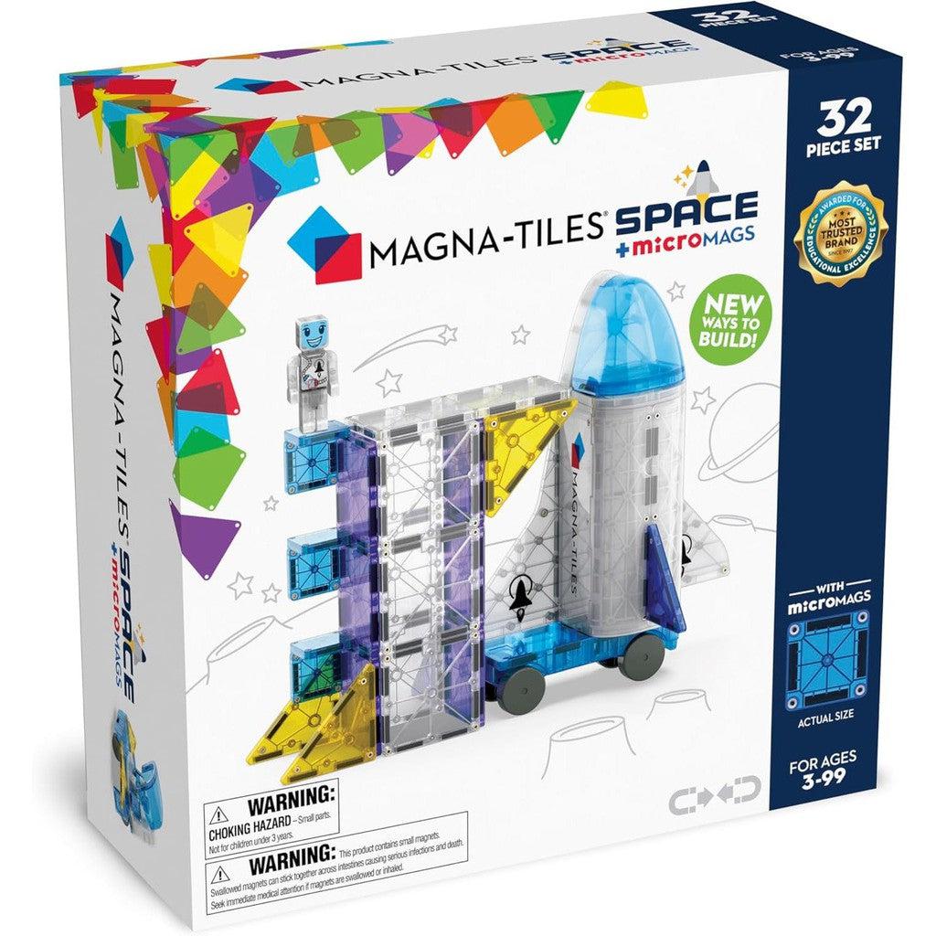 Discover the Box of MAGNA-TILES Space with microMags, featuring a rocket crafted from vibrant magnetic tiles. This Magnetic Construction Set includes 32 pieces, perfect for building enthusiasts ages 3-99.