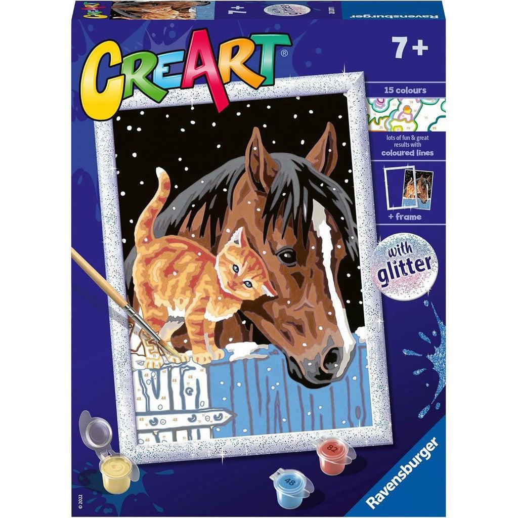 The Ravensburger Stable Friends art kit box features a paint-by-numbers image of a horse and a cat in the snow, complete with a brush and paint pots, making it perfect for painting arts and crafts enthusiasts.