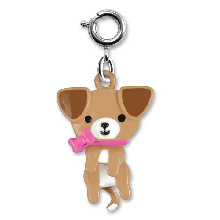 A small, brown cartoon dog charm with a pink bow and collar, perfect for an animal lover's charm bracelet, is attached to a silver clip.