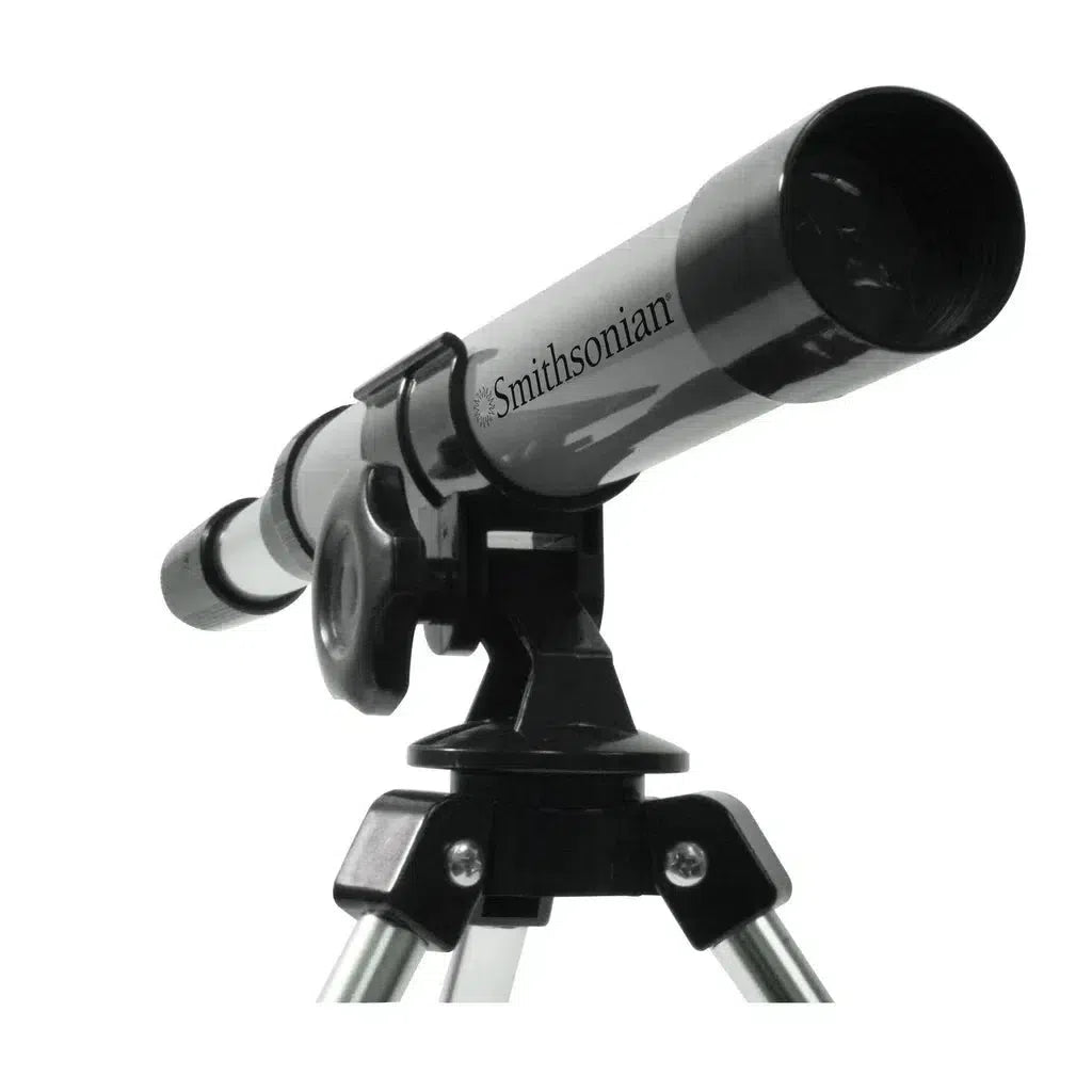 The Smithsonian Telescope, in sleek silver and black, is elegantly mounted on a tripod and angled skyward, inspiring young scientists with every star it captures. A perfect STEM toy to spark curiosity and exploration.