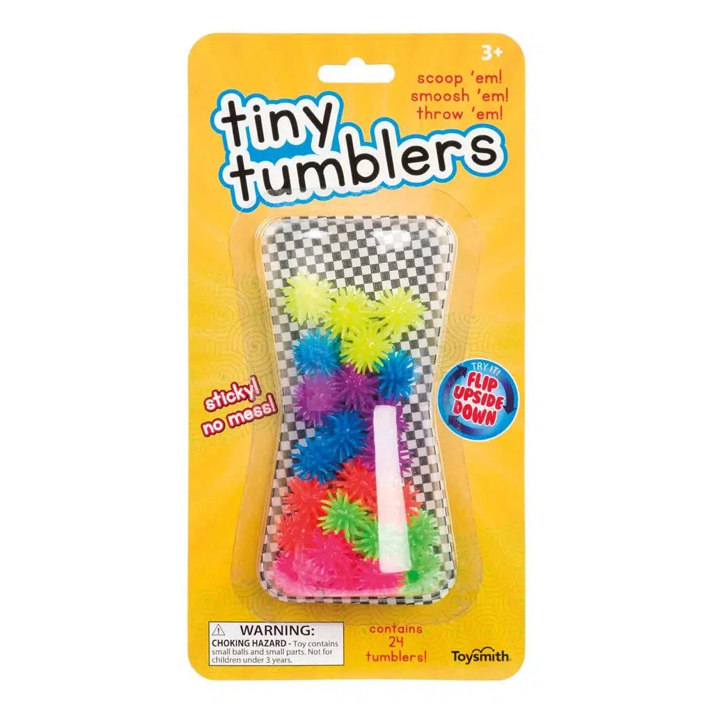 Packaging of "Tiny Tumblers" toy with colorful spiky squish balls and a white stick, labeled as sticky, made from silicone material for ages 3 and up, offering a delightful sensory experience.