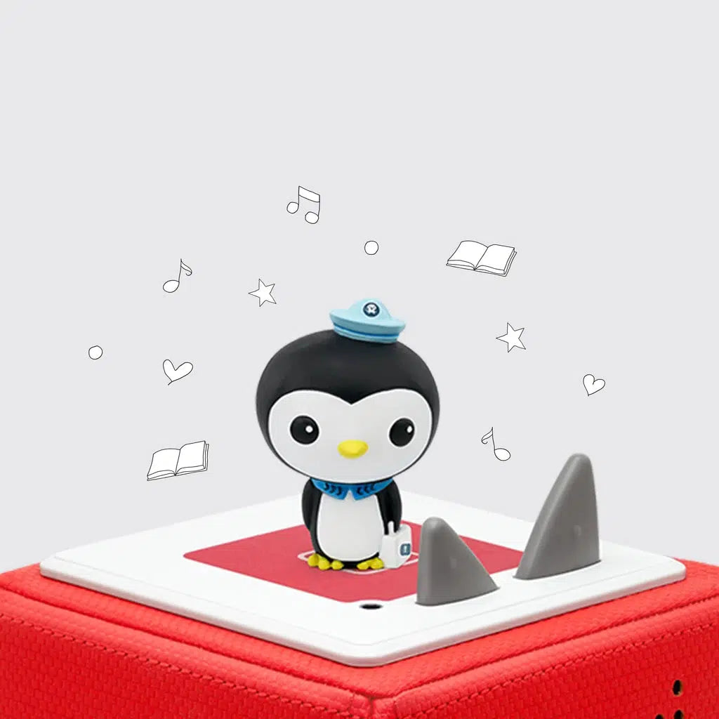 The tonie figure is shown on a toniebox. The figure is peso from octonauts, a penguin with a small sailors hat and wearing just the collar of a sailors uniform.