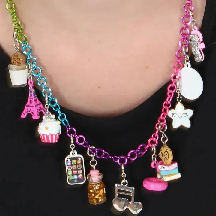 A multi-colored chain necklace with delightful charms like a cupcake, music notes, star, and a miniature Eiffel Tower adds flair to her look. She can customize her collection with matching bracelets or even cell phone charms for a personalized touch.