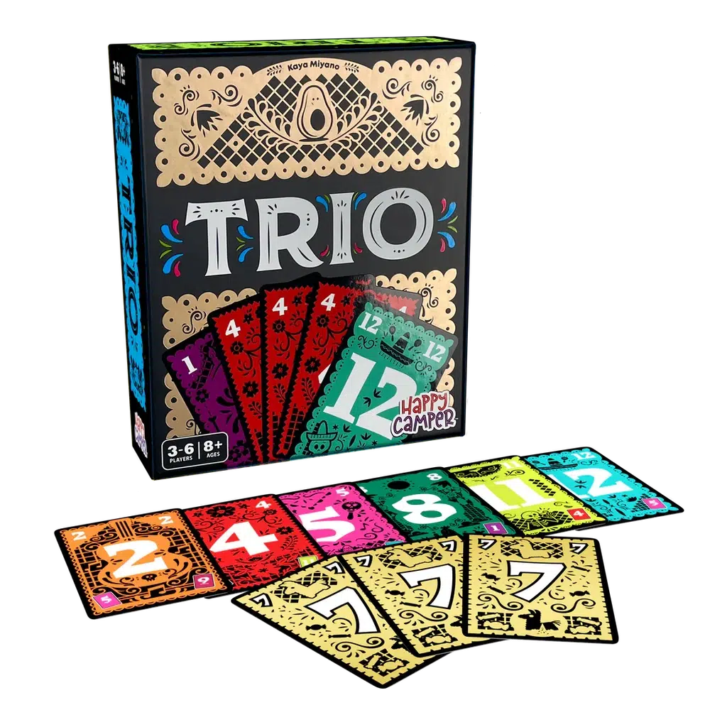 Box of the game TRIO with a display of a few cards. The box is colorful and decorated in a traditional Mexican style, with golden accents.