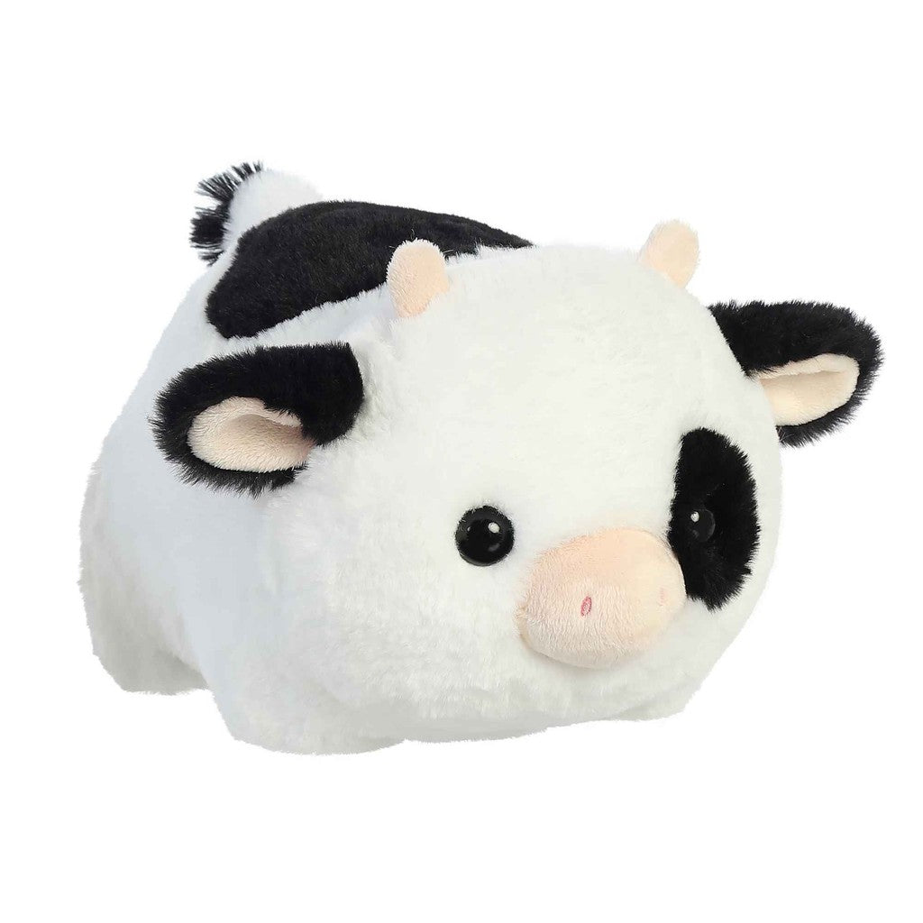 This adorable Spudsters plush toy, known as Tutie Cow, features black and white fur, round eyes, a pink snout, and small ears.