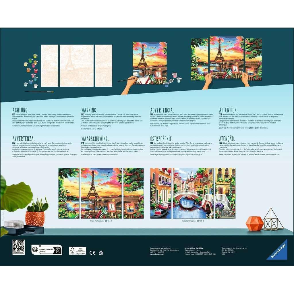 Instructional diagram showing hands painting a Ravensburger CreArt triptych of the Eiffel Tower and Venetian Dreams scenes, with multilingual warning text and art supplies at the top and bottom of the image.