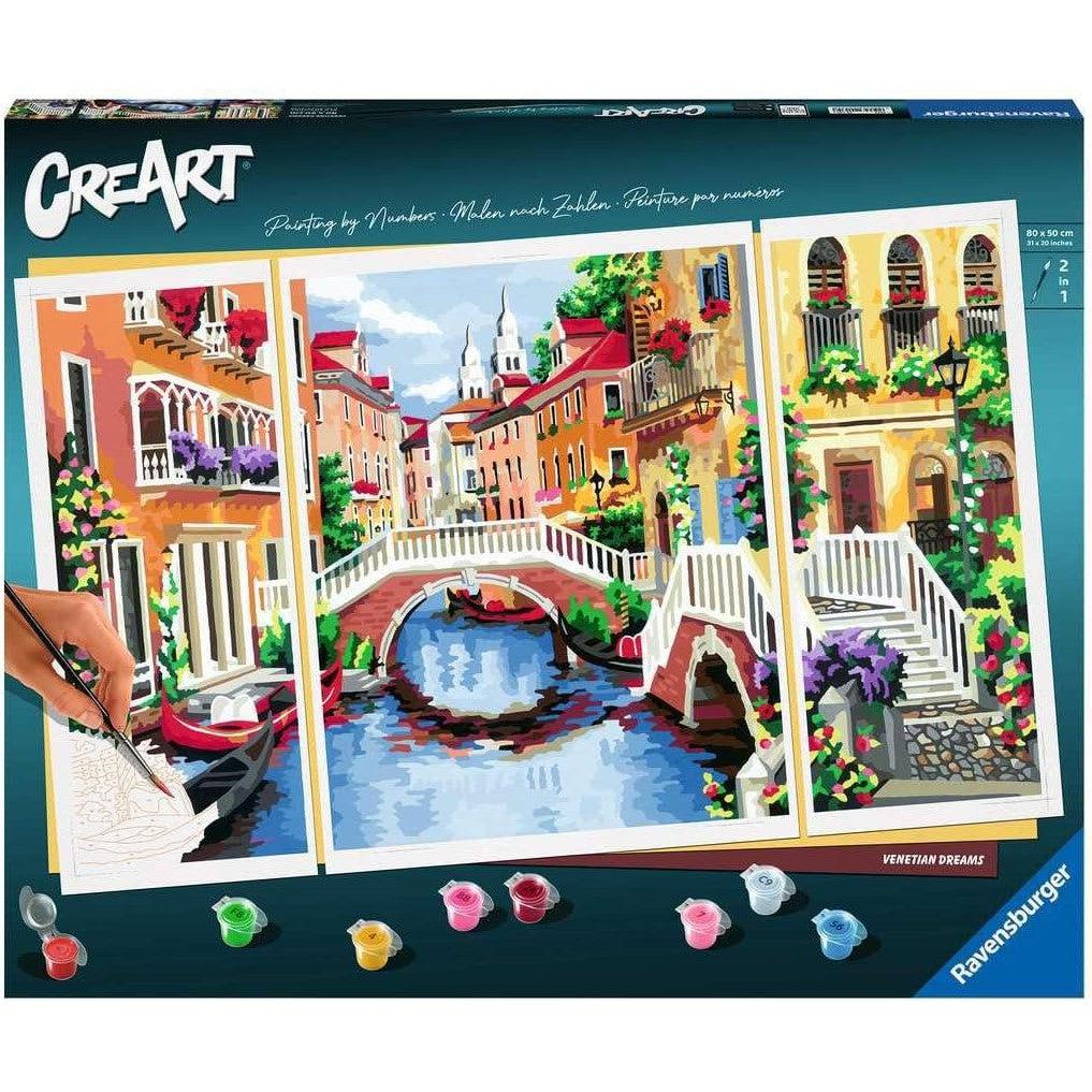 Venetian Dreams by Ravensburger CreArt is a vibrant paint by numbers kit showcasing a canal scene with three panels, featuring a charming bridge, gondolas, and historic buildings. Paints are included for your creative journey.