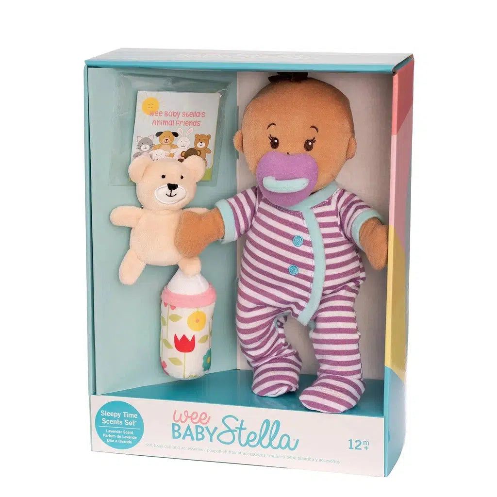 Wee Baby Stella doll in a striped outfit comes with a magnetic bottle, soft bear, and soothing pacifier, all beautifully presented in a display box.