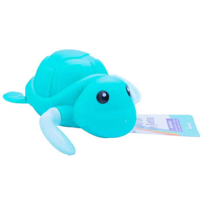 A teal plastic turtle toy with white flippers features a wind-up mechanism and a tag attached to its front flipper, ready to swim along wherever you take it.