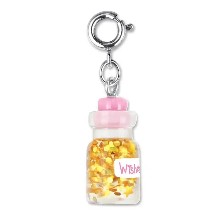 This customizable bottle of wishes charm is a small glass container filled with gold star-shaped glitter, labeled "Wishes." It features a pink plastic cap and a metal clasp for easy attachment to your bracelet.