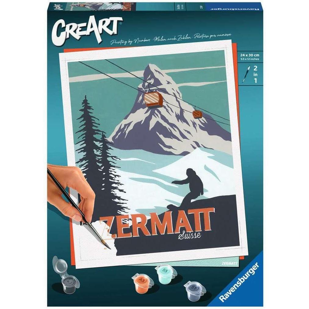 The box cover of the Ravensburger Zermatt Paint by Numbers kit showcases a mesmerizing mountain scene, complete with a ski lift and adventurous snowboarder. Labeled "ZERMATT Suisse," it includes paintbrush and paint pots, perfect for painting arts and crafts enthusiasts.